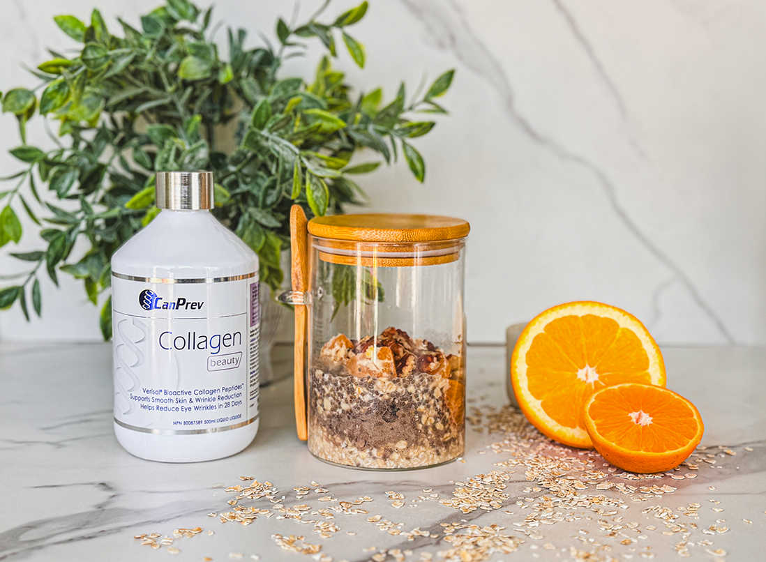 Orange Dreamsicle Collagen Overnight Oats in a glass jar. with oranges and oats around it.